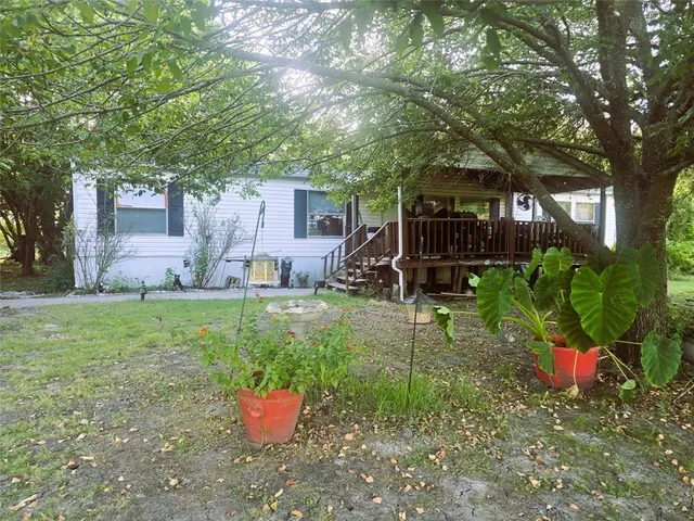 a backyard of a house with lots of green space