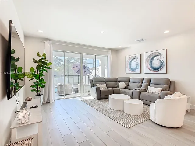 a living room with furniture and a table