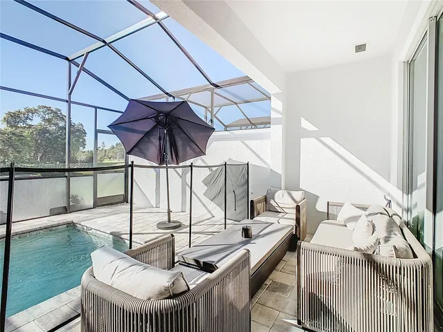 a view of a two chairs in the patio