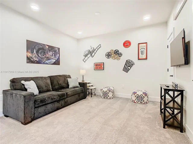 a living room with furniture and a night stand
