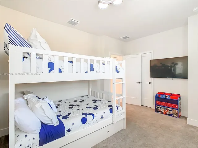 a bathroom with a sink mirror and vanity