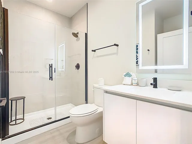 a view of a hallway with white walls