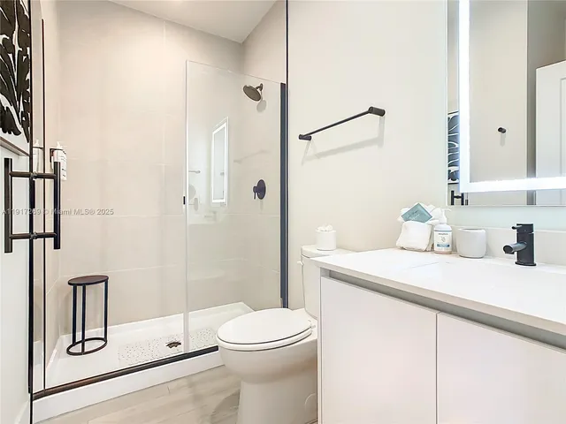 a bedroom with a bed and a lamp