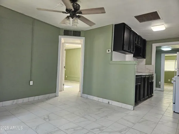 a view of a kitchen with a sink and dishwasher cabinets