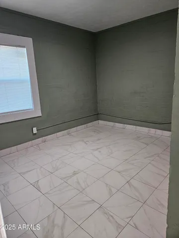 a view of a utility room with closet