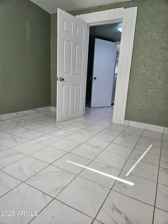 a view of a livingroom and window