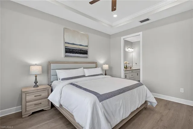 a bedroom with a bed and a lamp