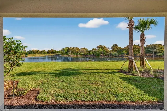 a view of a lake with a big yard