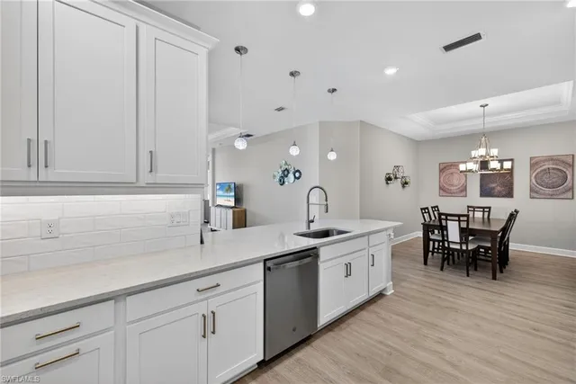 a kitchen with a sink and cabinets