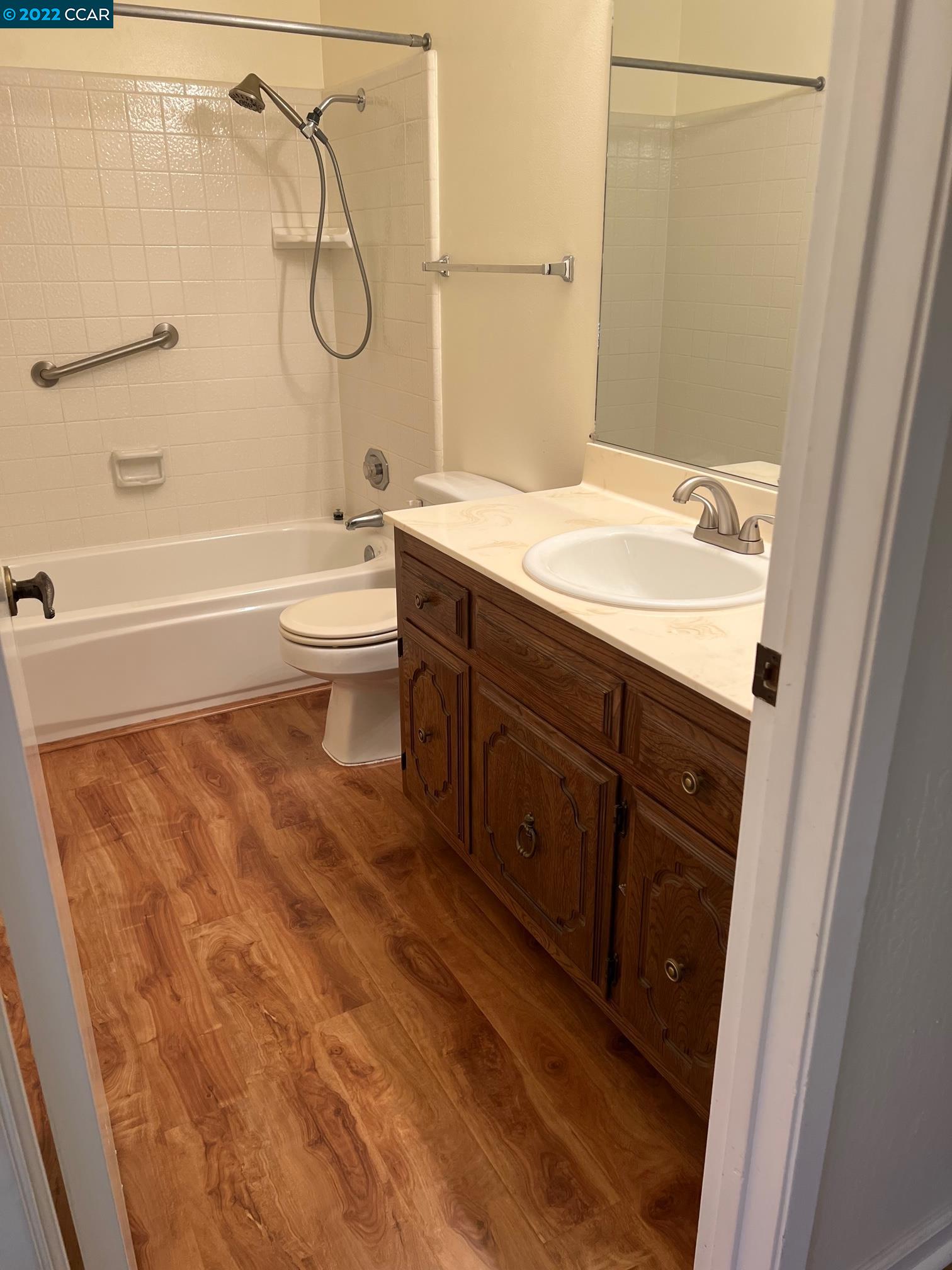 5328 Paso Del Rio Way Concord, CA 94521 - Photo 16 of 22 a bathroom with a granite countertop sink a toilet and shower