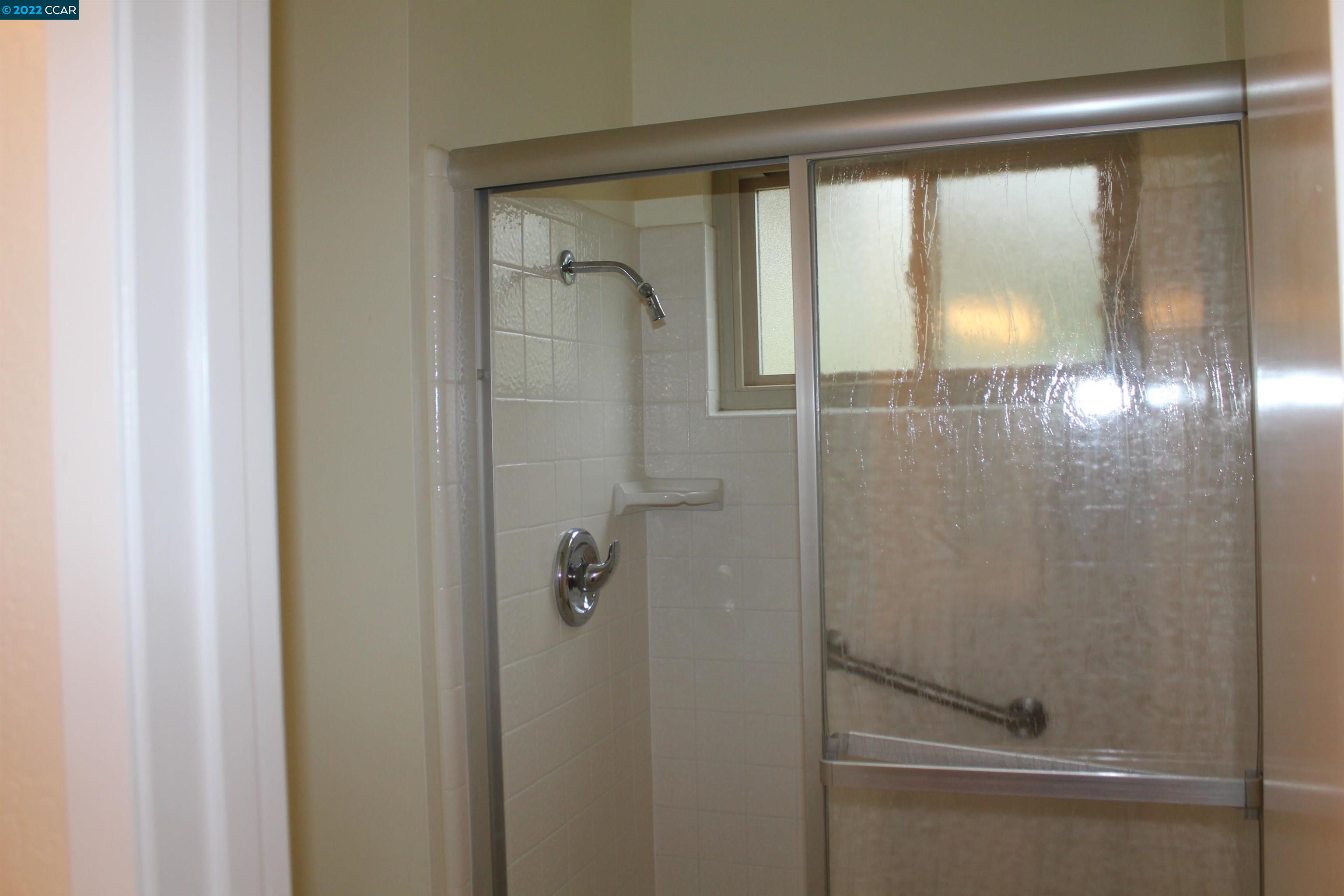 5328 Paso Del Rio Way Concord, CA 94521 - Photo 17 of 22 a bathroom with a glass shower door