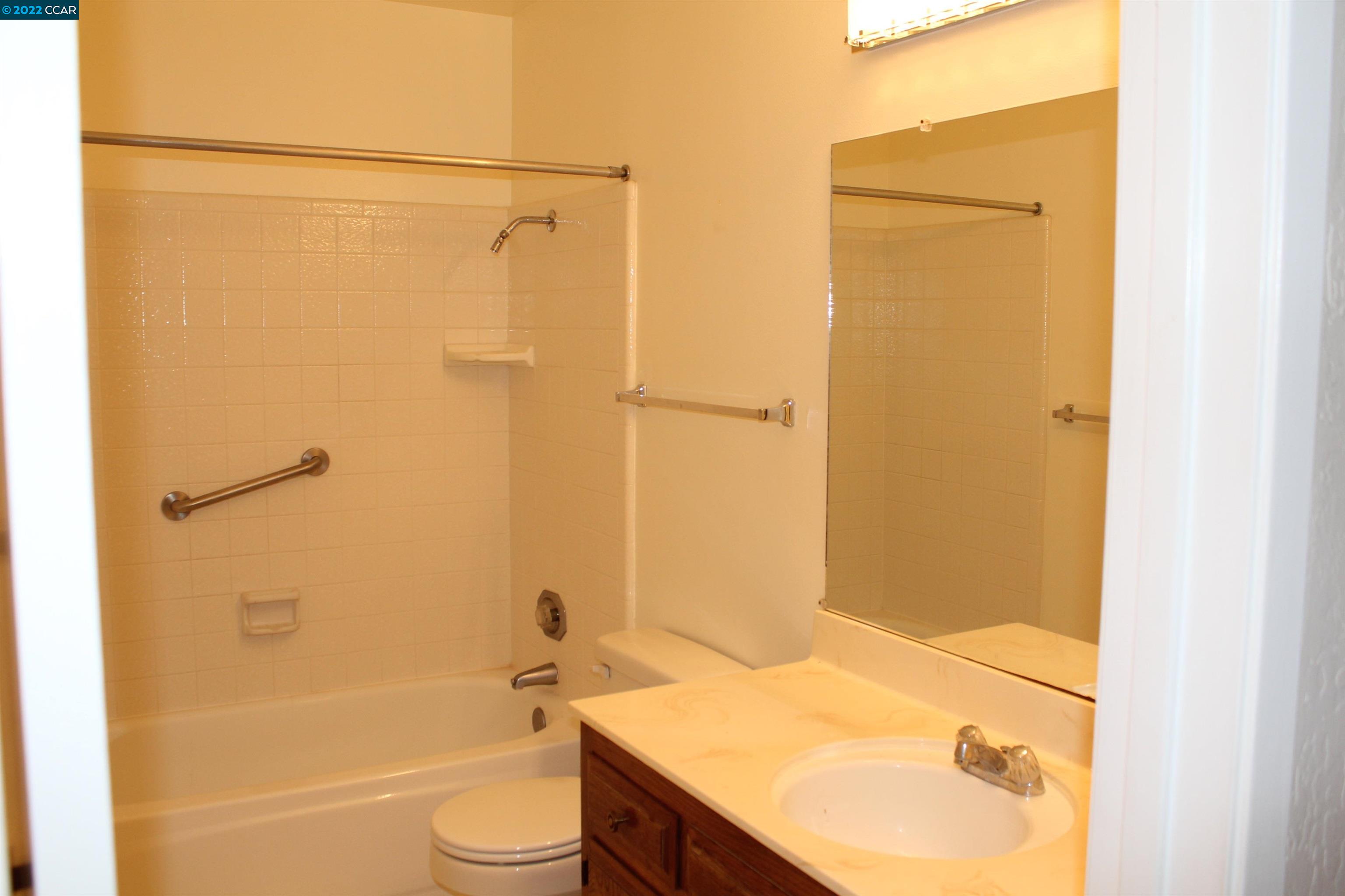 5328 Paso Del Rio Way Concord, CA 94521 - Photo 18 of 22 a bathroom with a granite countertop sink toilet and shower