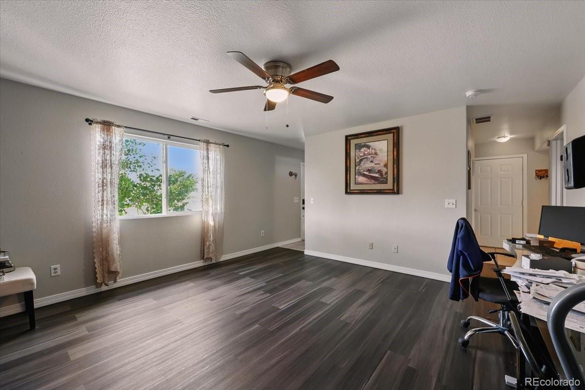 17435 Wagon Train Loop Peyton, CO 80831 - Photo 14 of 40 a view of a workspace with furniture and a window