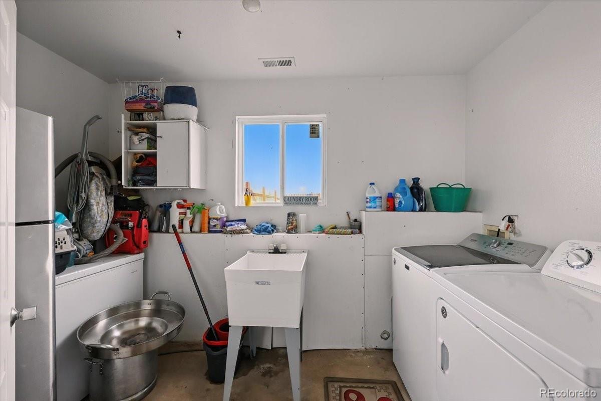 17435 Wagon Train Loop Peyton, CO 80831 - Photo 21 of 40 a room with storage and utility