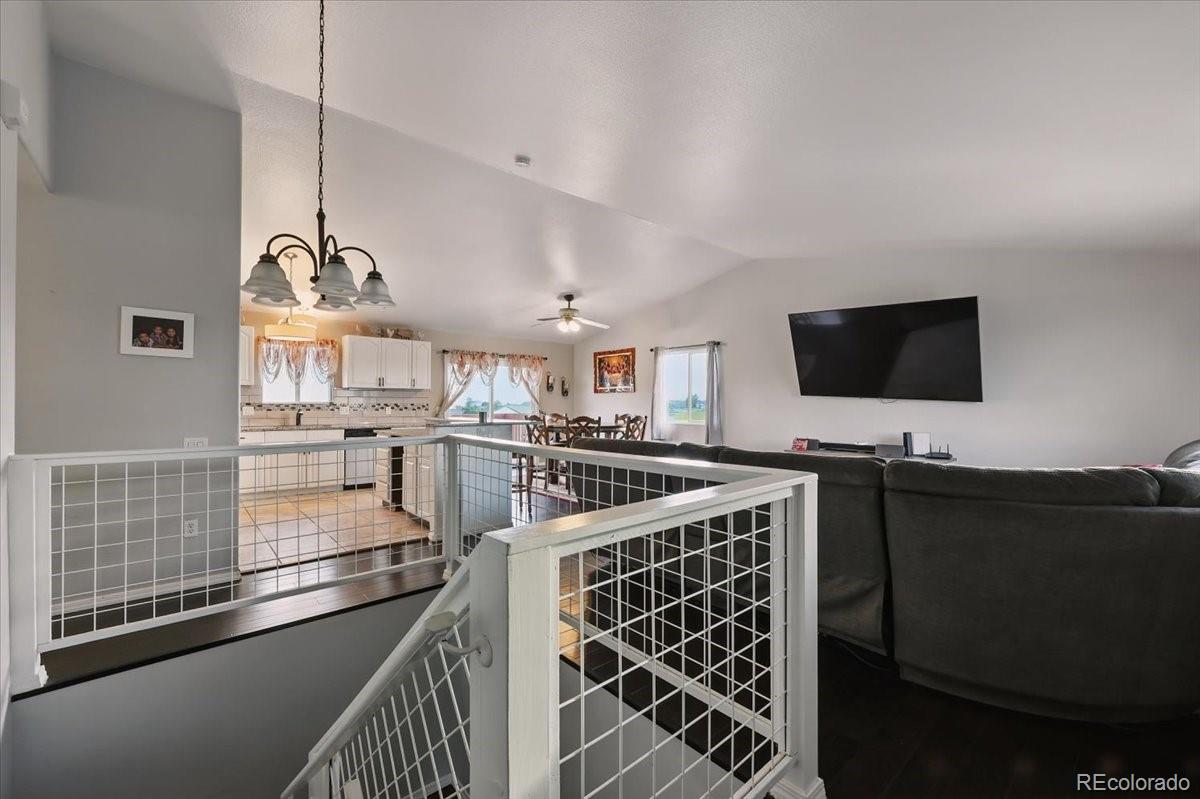 17435 Wagon Train Loop Peyton, CO 80831 - Photo 22 of 40 a kitchen with counter top space and appliances