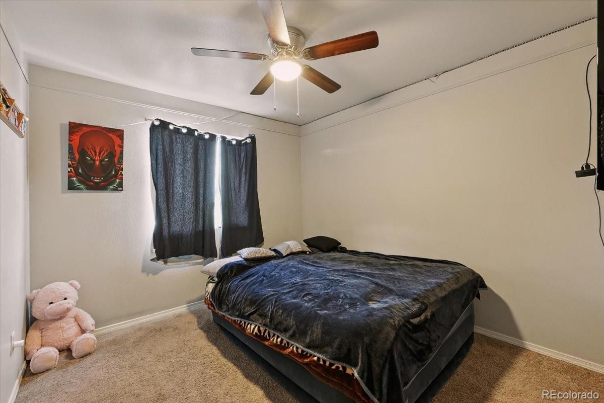 17435 Wagon Train Loop Peyton, CO 80831 - Photo 27 of 40 a bedroom with a bed and a window