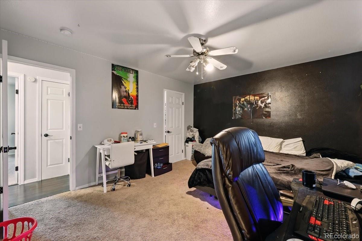 17435 Wagon Train Loop Peyton, CO 80831 - Photo 31 of 40 a view of a workspace with furniture and a chandelier