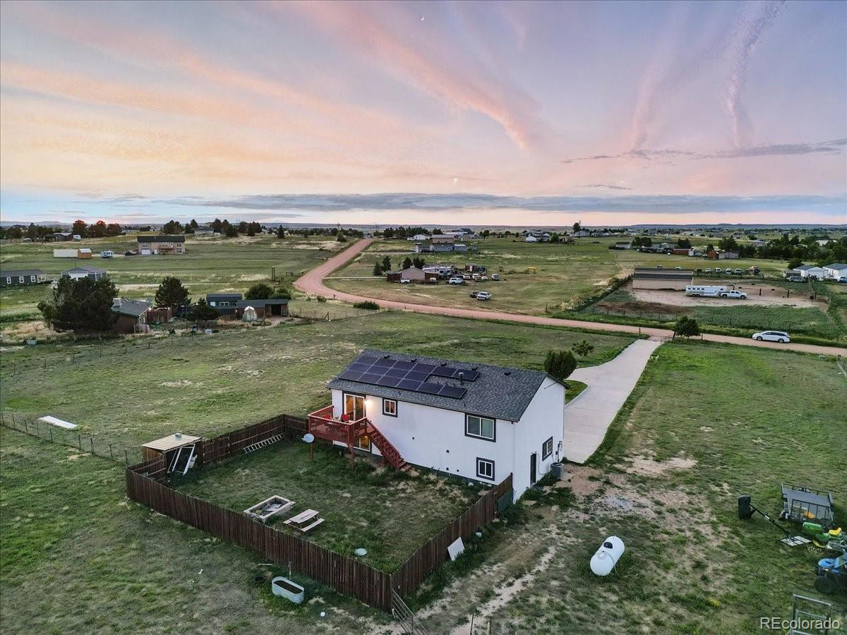 17435 Wagon Train Loop Peyton, CO 80831 - Photo 35 of 40 an aerial view of a house with a garden and lake view