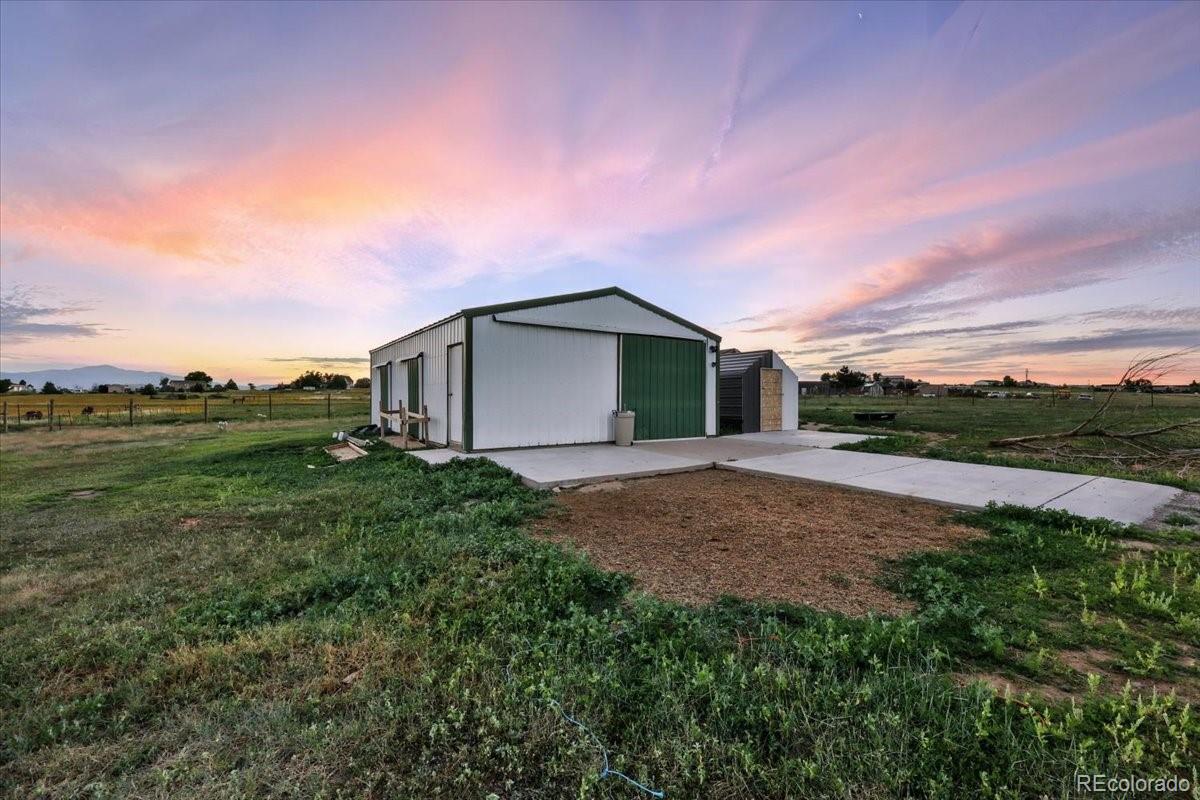 17435 Wagon Train Loop Peyton, CO 80831 - Photo 37 of 40 a backyard of a house with lots of green space and mountain view in back