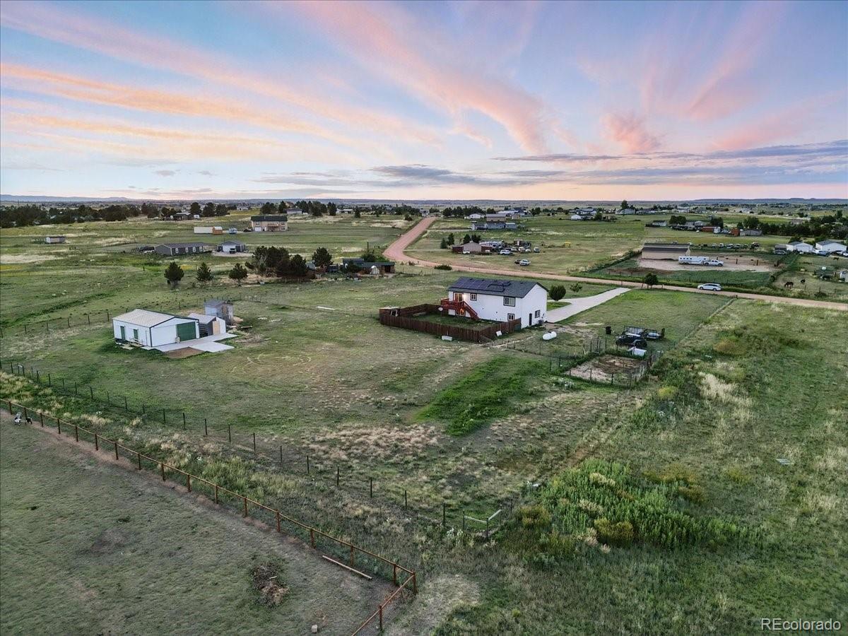 17435 Wagon Train Loop Peyton, CO 80831 - Photo 38 of 40 a view of a town with couple of cars parked on road