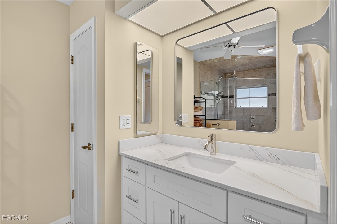 4306 Southwest 3rd Avenue Cape Coral, FL 33914 - Photo 24 of 50 a bathroom with a sink and a mirror