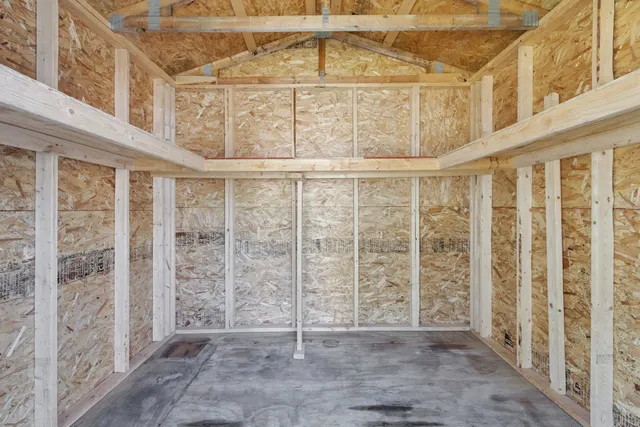 a view of a house with a yard and garage