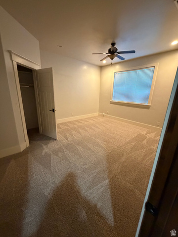 4536 North 475 East Provo, UT 84604 - Photo 21 of 65 Neutral tone wall paint, textured carpet flooring, window with blinds, ceiling fan with integrated lighting, and recessed lighting fixtures