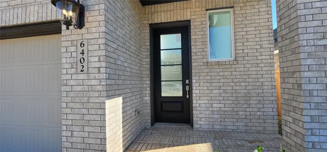 a bathroom with a double vanity sink and mirror