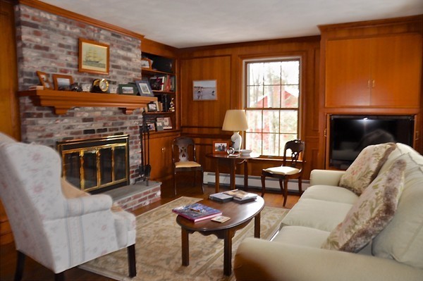 11 Pond Street Dover, MA 02030 - Photo 6 of 12 a living room with furniture a flat screen tv and a fireplace