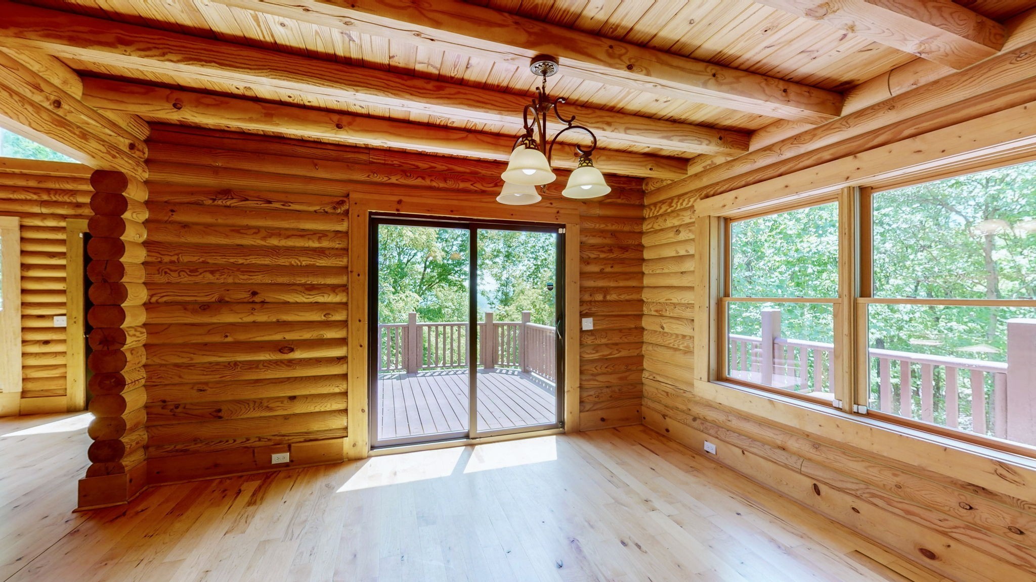 256 Vista Vue Trail Pelham, TN 37366 - Photo 11 of 67 a view of room with wooden floor and a floor to ceiling window