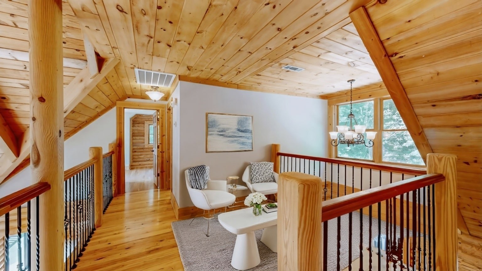 256 Vista Vue Trail Pelham, TN 37366 - Photo 15 of 67 a view of a balcony with chairs and wooden floor