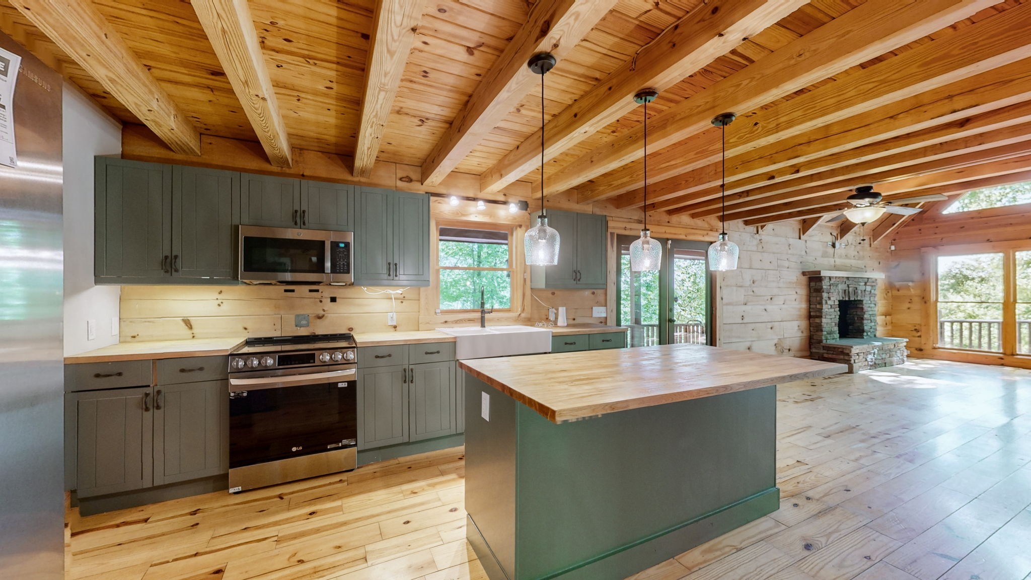 256 Vista Vue Trail Pelham, TN 37366 - Photo 41 of 67 a kitchen with stainless steel appliances granite countertop a sink stove and refrigerator