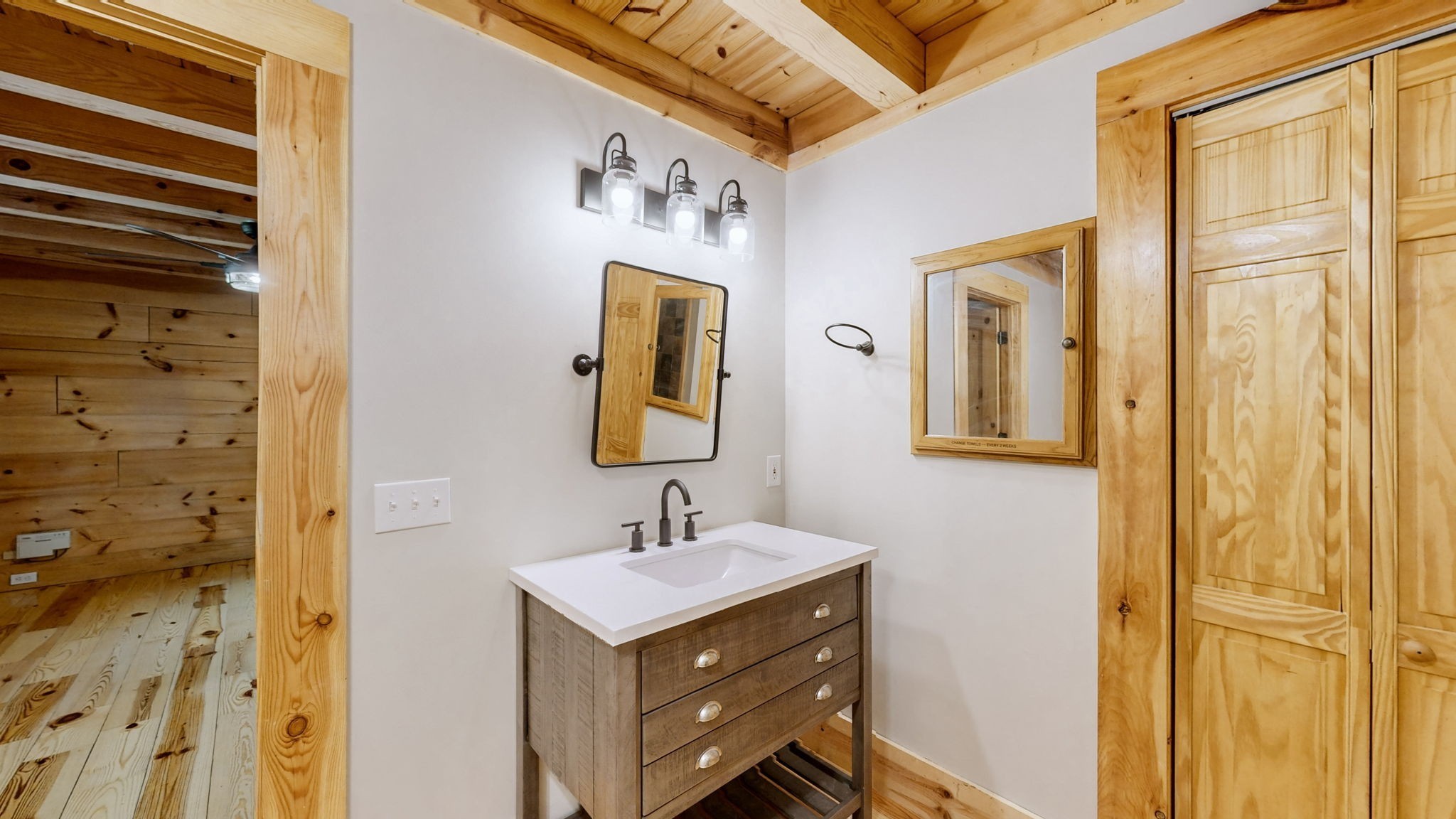 256 Vista Vue Trail Pelham, TN 37366 - Photo 47 of 67 a bathroom with a sink a mirror and a shower
