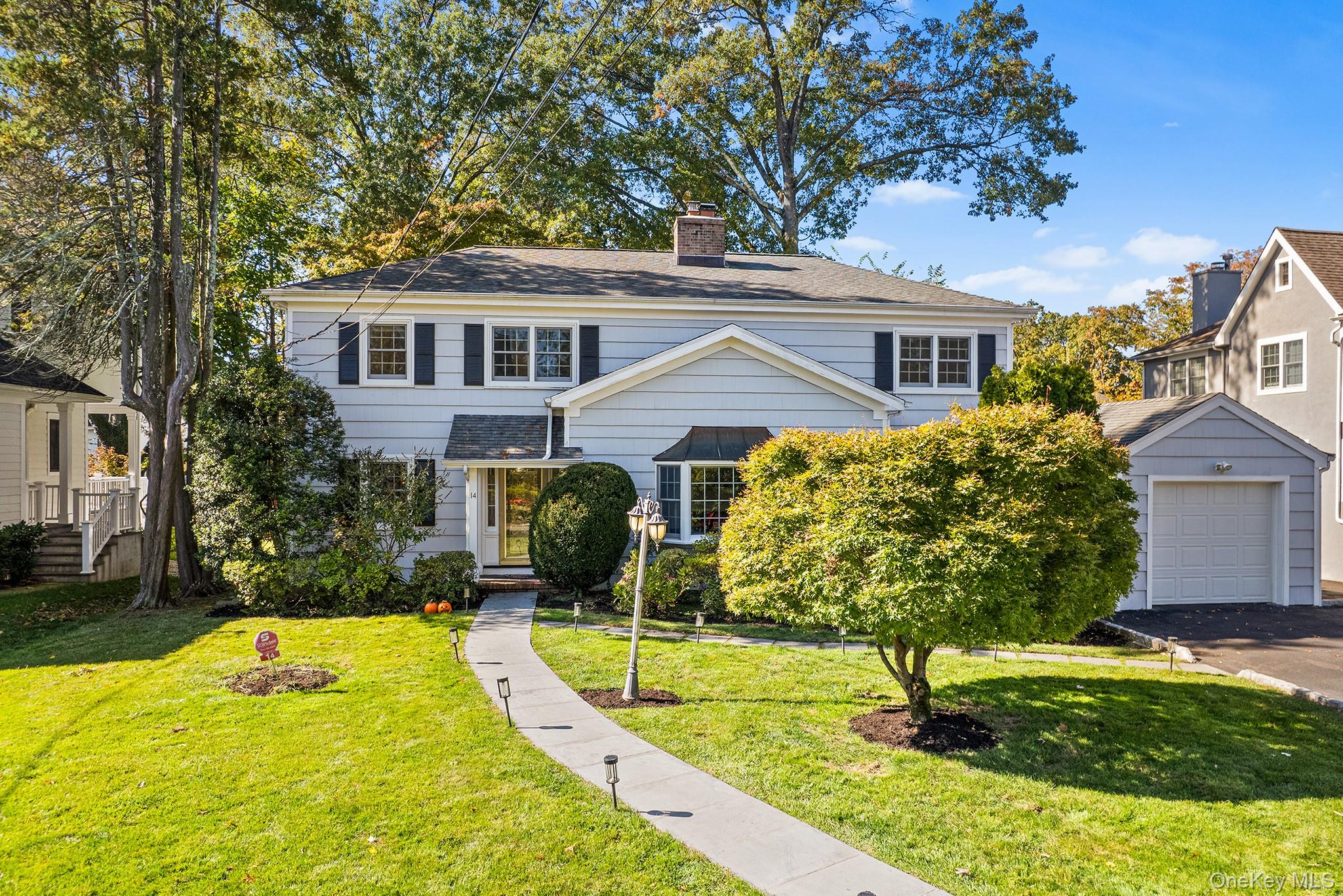 14 Wakefield Road Scarsdale, NY 10583 - Photo 1 of 1 a front view of a house with garden