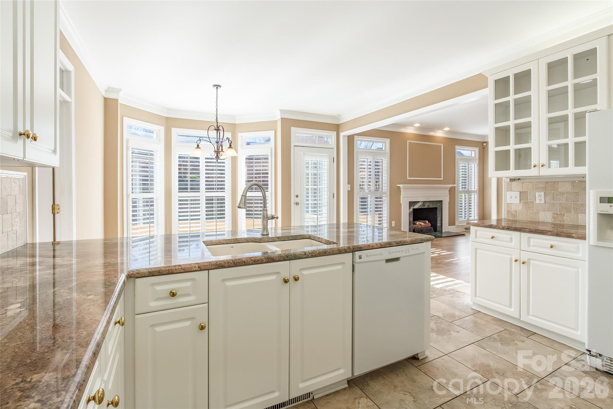 1909 Malvern Road Rock Hill, SC 29732 - Photo 16 of 40 a kitchen with granite countertop a stove and white cabinets