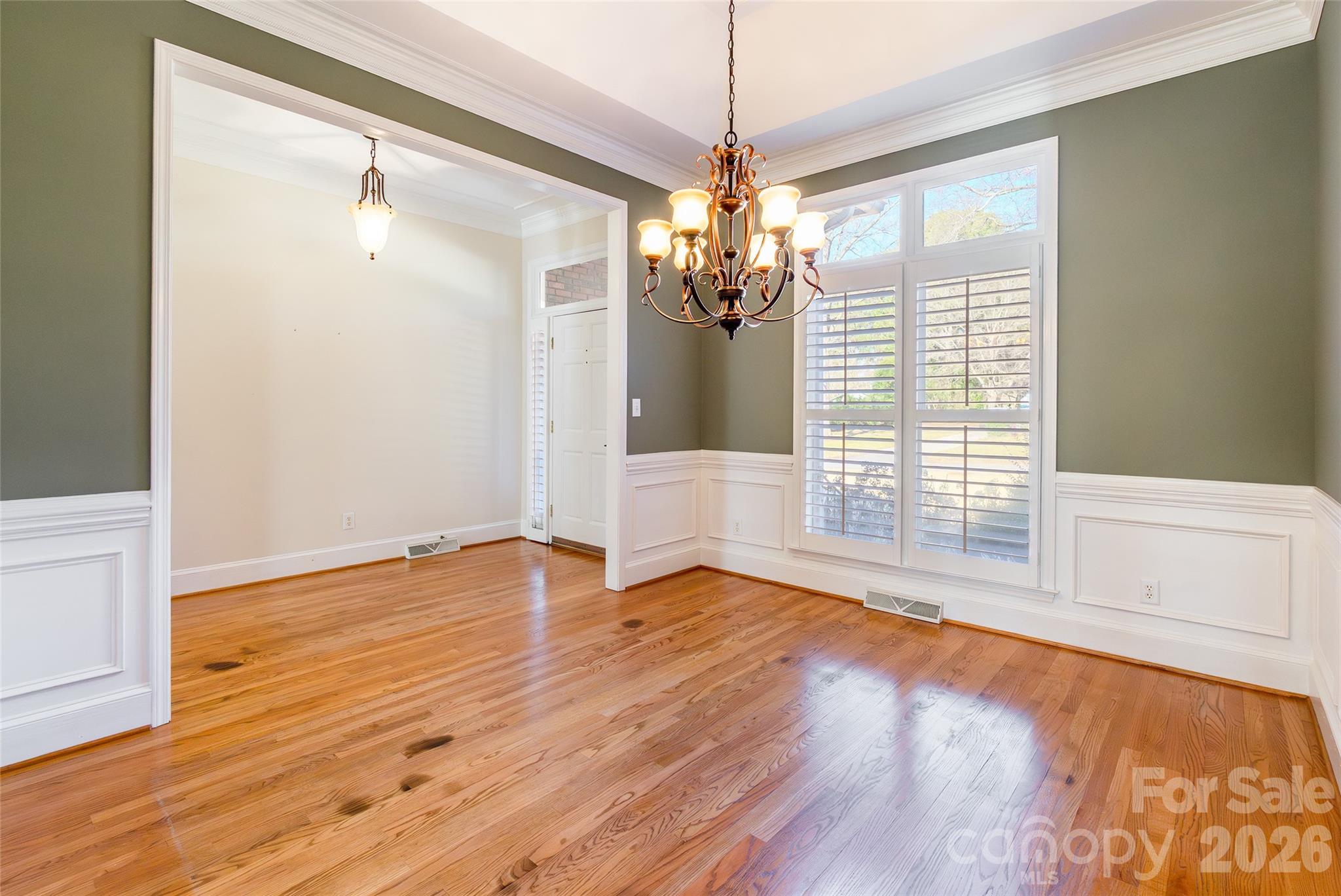 1909 Malvern Road Rock Hill, SC 29732 - Photo 7 of 40 a view of an empty room with wooden floor and a window