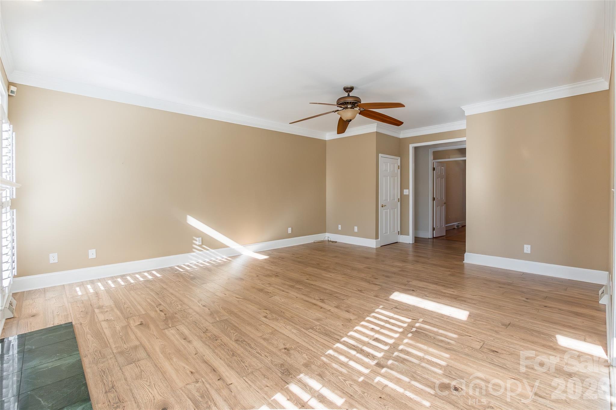 1909 Malvern Road Rock Hill, SC 29732 - Photo 10 of 40 a view of empty room with wooden floor and ceiling fan