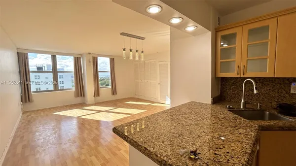 a view of a kitchen cabinets and a sink