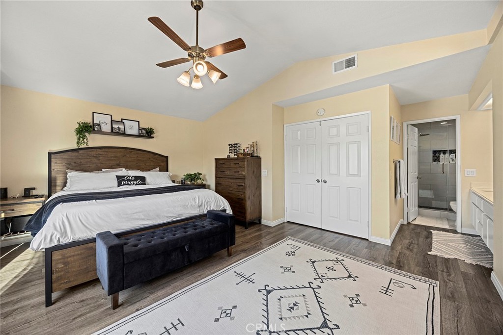 2027 Cobblefield Way Glendora, CA 91740 - Photo 19 of 34 a bedroom with a large bed and a chandelier