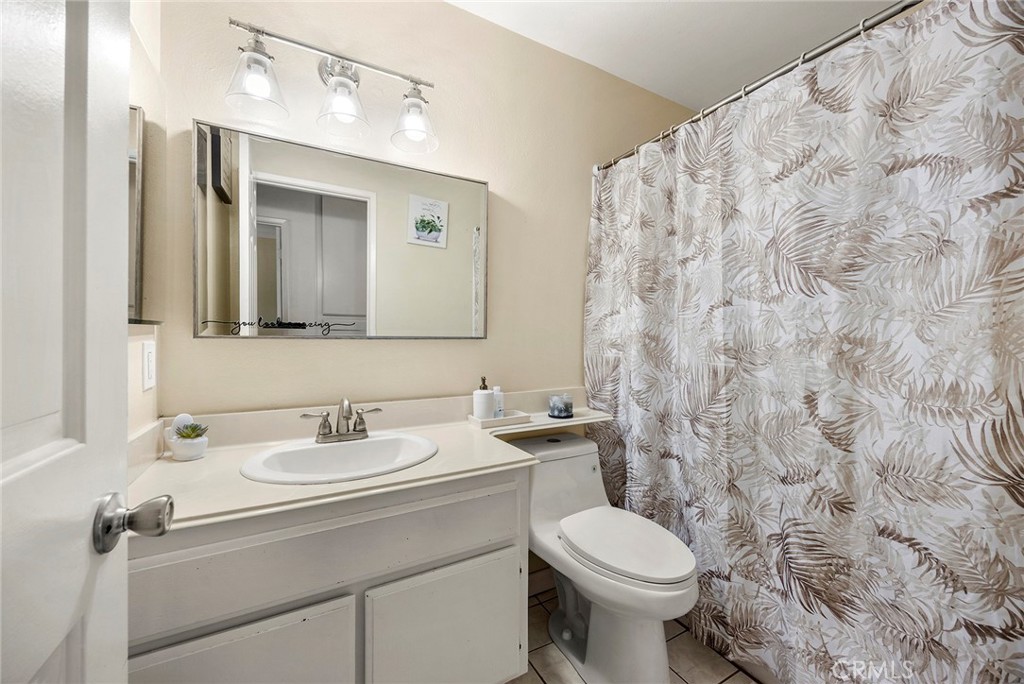 2027 Cobblefield Way Glendora, CA 91740 - Photo 25 of 34 a bathroom with a sink toilet and shower