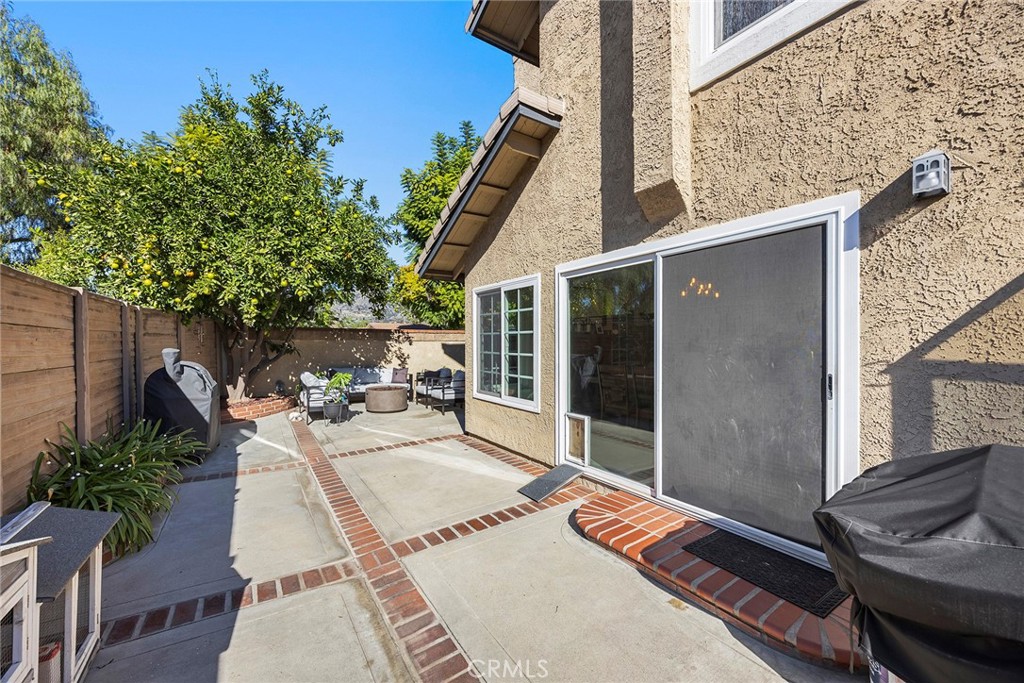 2027 Cobblefield Way Glendora, CA 91740 - Photo 26 of 34 a view of a patio with table and chairs potted plants with wooden floor and fence