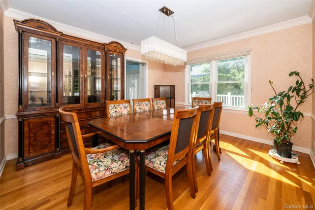 a dining room with furniture and wooden floor