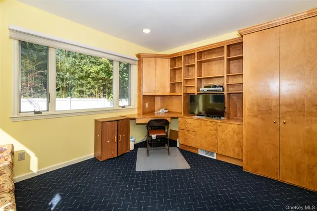 a room with furniture and a window