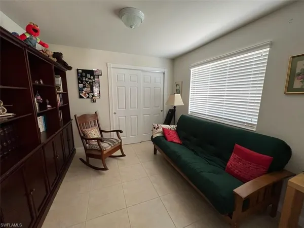 a living room with furniture and a window