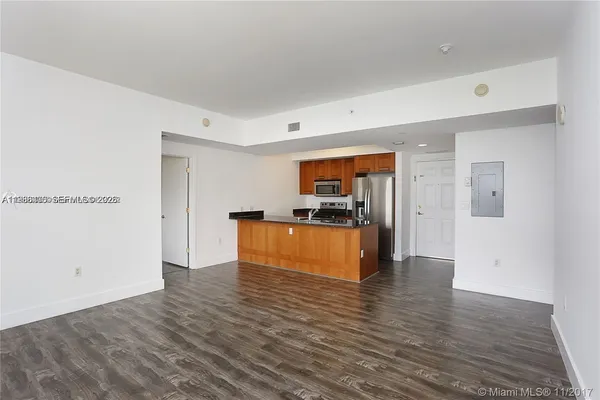 a view of kitchen with wooden floor