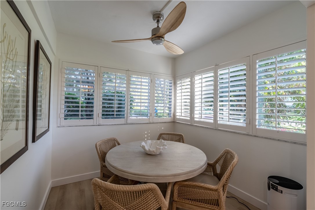 503 Broad Avenue South, Unit 503 Naples, FL 34102 - Photo 6 of 20 a view of a dining room with furniture window and outside view