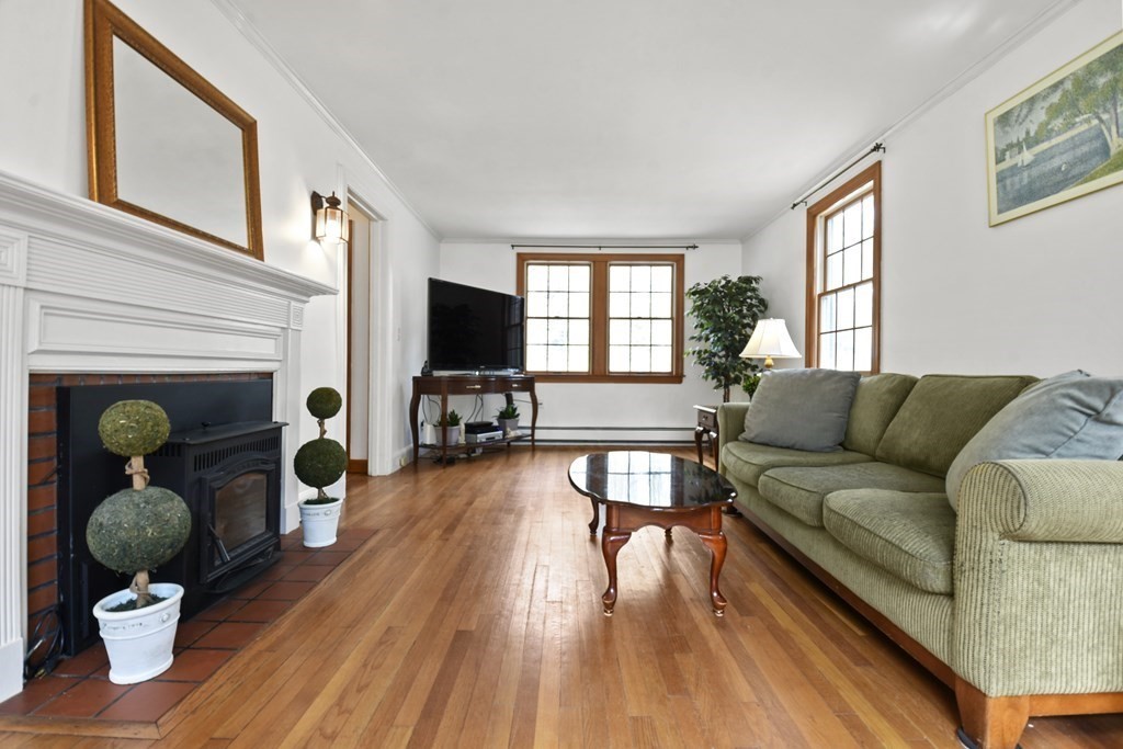 68 Winchendon Road Templeton, MA 01436 - Photo 12 of 30 a living room with furniture a fireplace and a flat screen tv