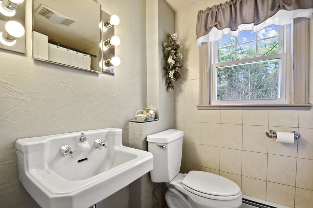 68 Winchendon Road Templeton, MA 01436 - Photo 24 of 30 a bathroom with a sink mirror and toilet