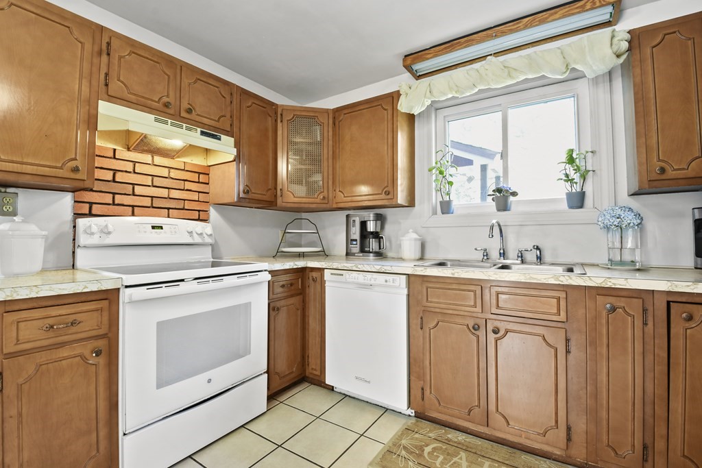 68 Winchendon Road Templeton, MA 01436 - Photo 4 of 30 a kitchen with white cabinets and white appliances