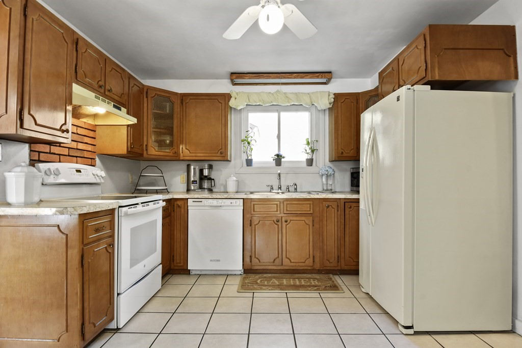 68 Winchendon Road Templeton, MA 01436 - Photo 5 of 30 a kitchen with stainless steel appliances granite countertop a refrigerator sink and white cabinets